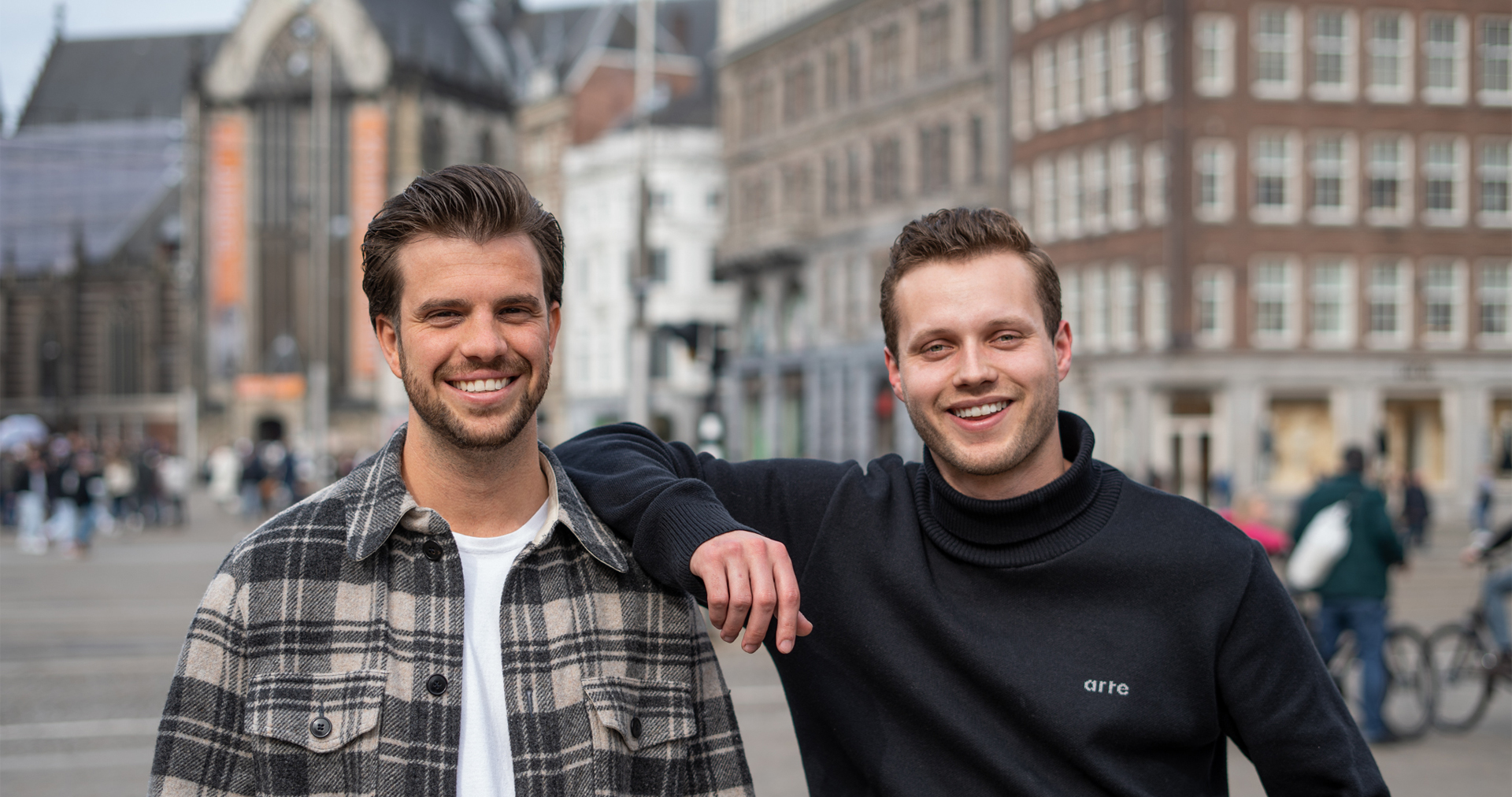 Sqales Founder Nick and Sales Manager Tijmen outside our story banner